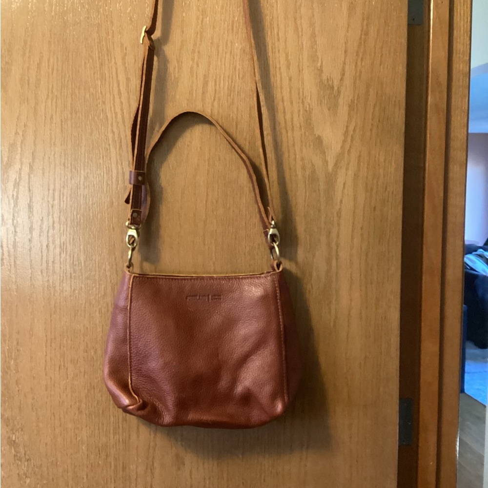 Portland Leather Triangle bag with crossbody strap.